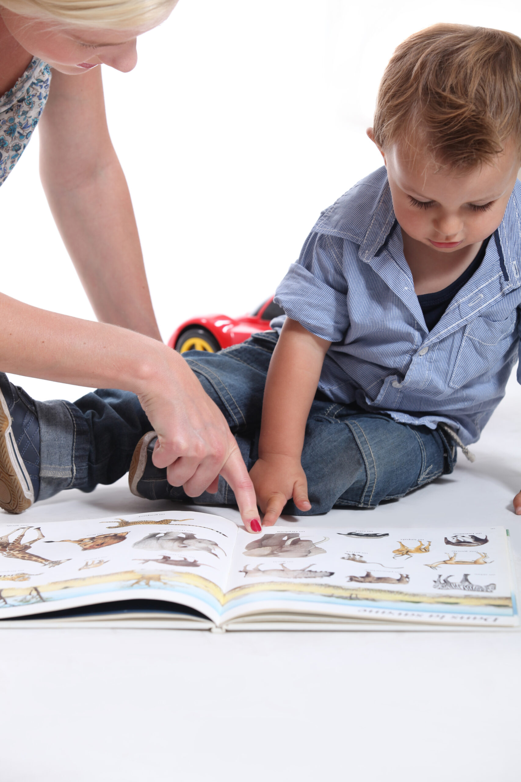 Mother,And,Child,Looking,At,A,Book at St. Stephen's Day Care